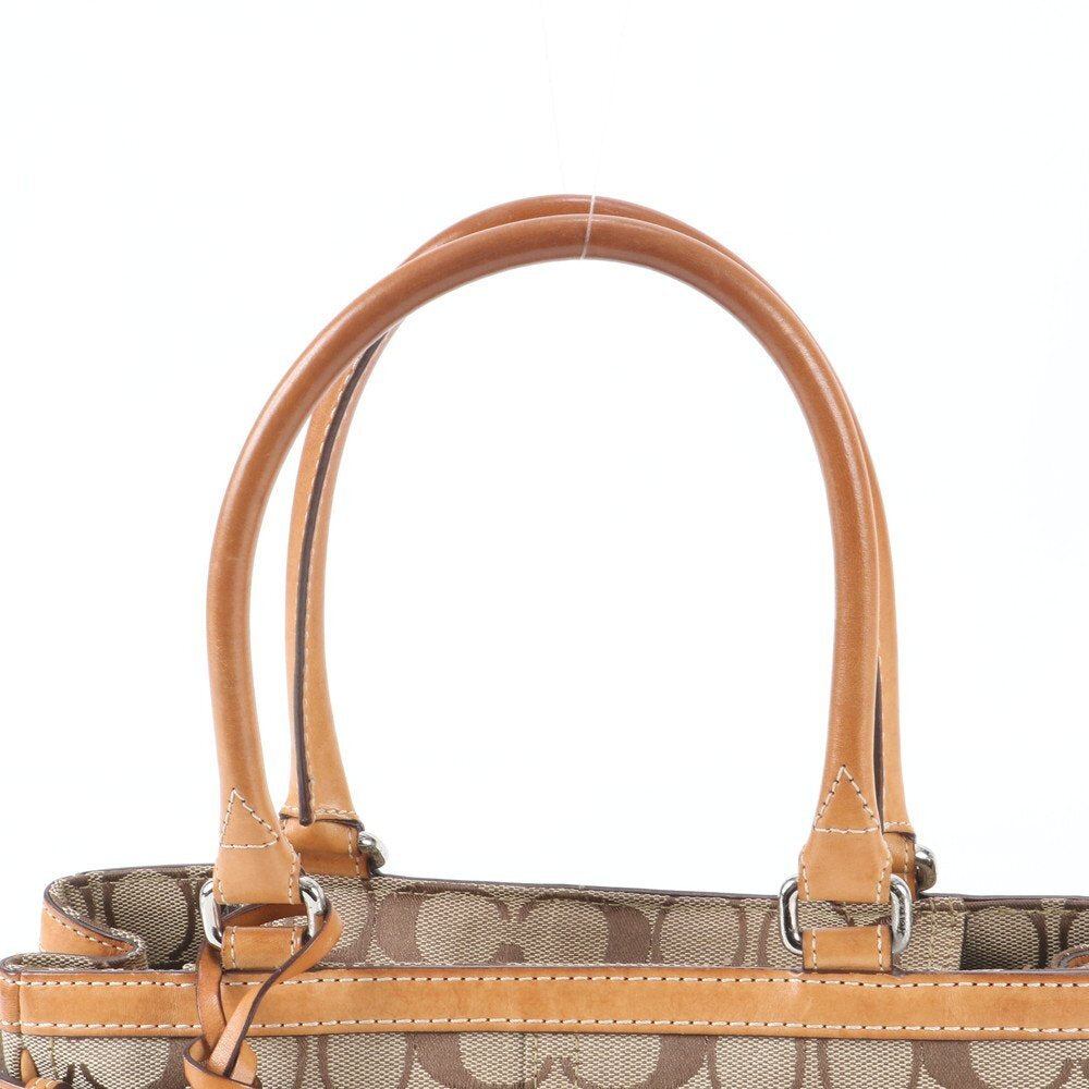 Coach Signature Monogram Canvas Handtasche