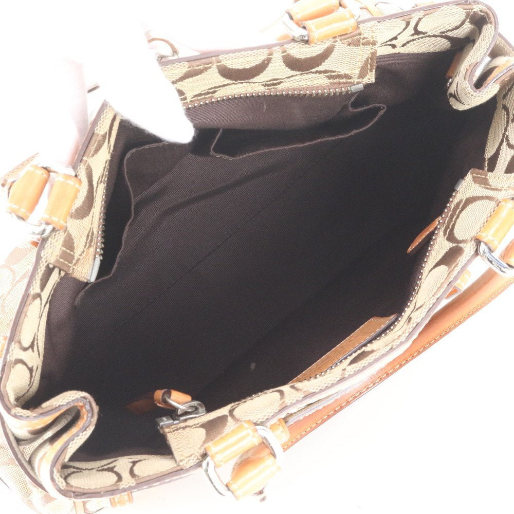 Coach Signature Monogram Canvas Handtasche