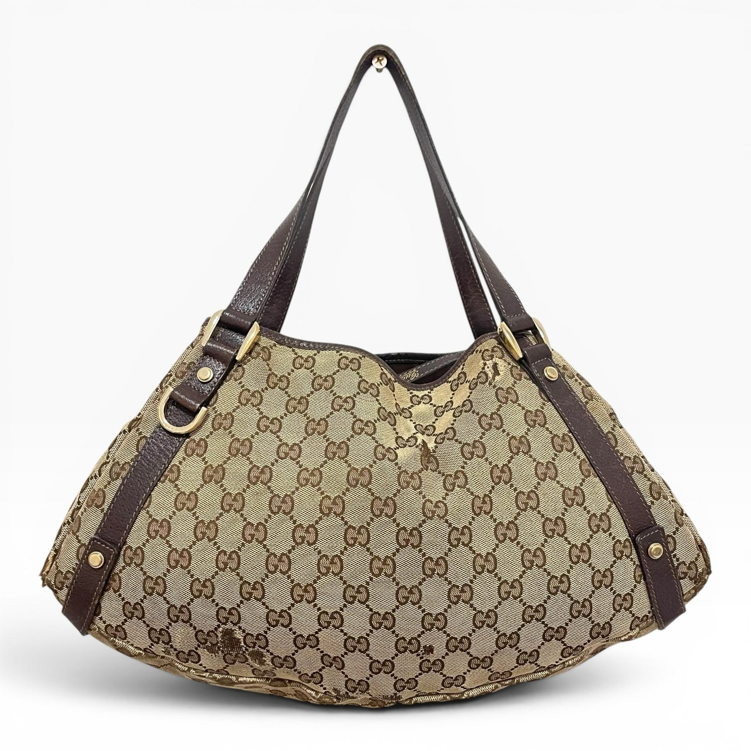 Túi xách The Vintage Mansion Gucci GG canvas màu be với chi tiết da nâu và phần cứng kim loại sang trọng