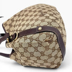 Túi đeo vai The Vintage Mansion Gucci GG canvas màu be với chi tiết da nâu sang trọng và phần cứng kim loại