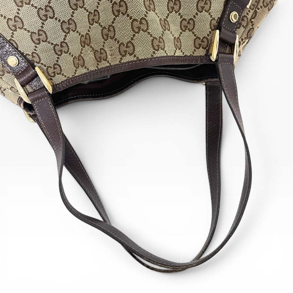 Túi đeo vai The Vintage Mansion Gucci GG canvas họa tiết monogram với quai da nâu và chi tiết kim loại sang trọng